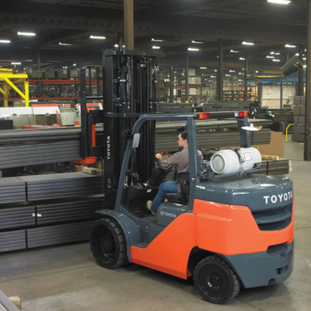 Forklift rental machine moving materials inside warehouse