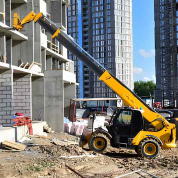 Telehandler rental lifting construction materials at building site