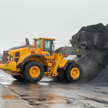 Wheel loader rental machine loading heavy construction material